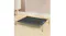 Front angled view of black raised mesh pet cot with silver steel legs on a timber floor Front angled view of black raised mesh pet cot with silver steel legs on a timber floor