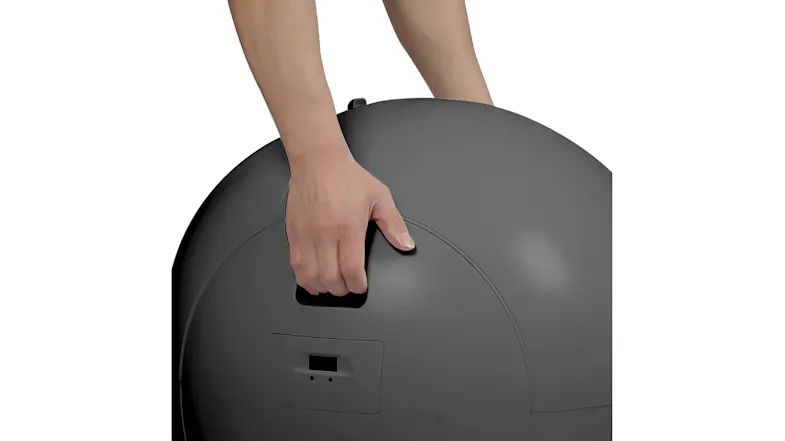 Close-up rear view of a black automatic cat litter box with a built-in carry handle and control panel Close-up rear view of a black automatic cat litter box with a built-in carry handle and control panel