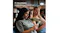 Two women seated indoors showing 4‑way privacy blocking side view of phone Two women seated indoors showing 4‑way privacy blocking side view of phone