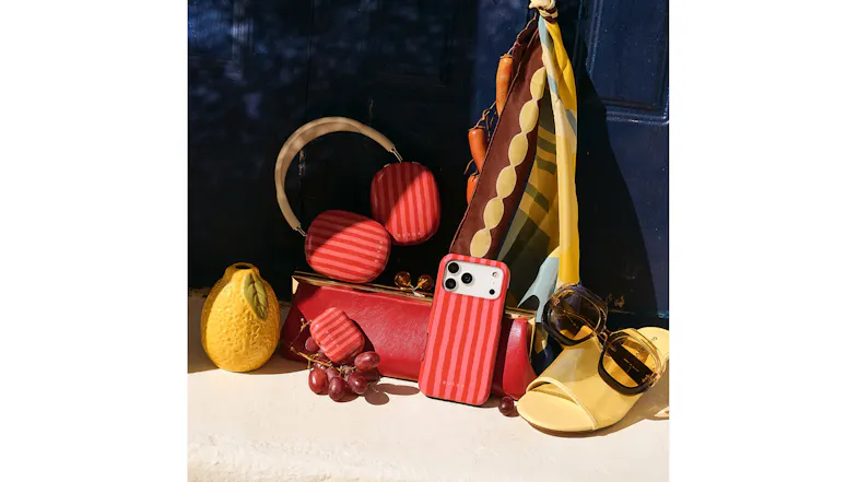 BURGA striped phone case with matching earbuds cover, displayed with fashion accessories and sunglasses BURGA striped phone case with matching earbuds cover, displayed with fashion accessories and sunglasses