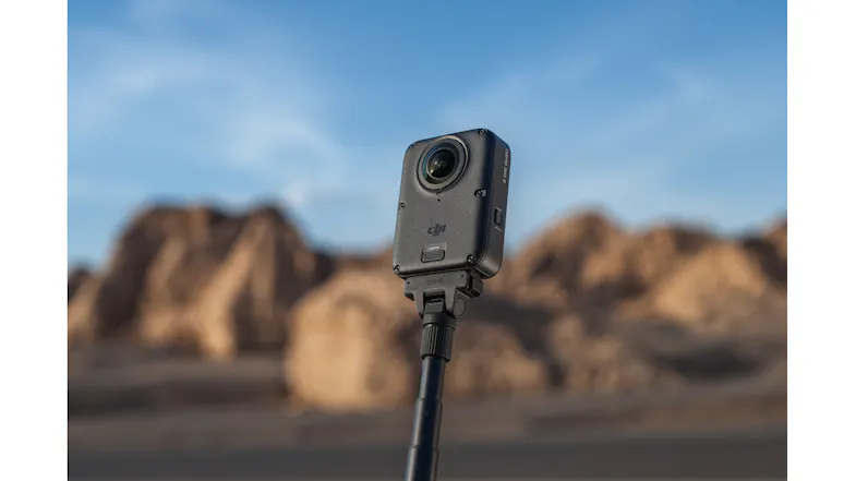 DJI Osmo 360 camera mounted on an extension pole in a rocky desert setting DJI Osmo 360 camera mounted on an extension pole in a rocky desert setting