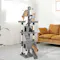 Grey PaWz cat tower in a living room with dual condos, elevated perches, sisal posts, and hanging toys Grey PaWz cat tower in a living room with dual condos, elevated perches, sisal posts, and hanging toys