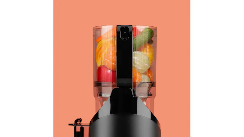 Close-up of a black NutriBullet juicer control dial with a hand adjusting the speed setting on the front panel Close-up of a black NutriBullet juicer control dial with a hand adjusting the speed setting on the front panel