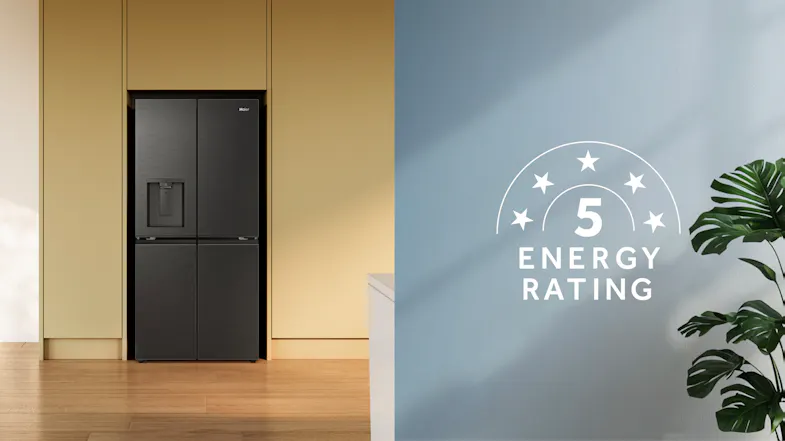 Black French door refrigerator installed in cabinetry, featuring a built-in water dispenser and brushed finish Black French door refrigerator installed in cabinetry, featuring a built-in water dispenser and brushed finish