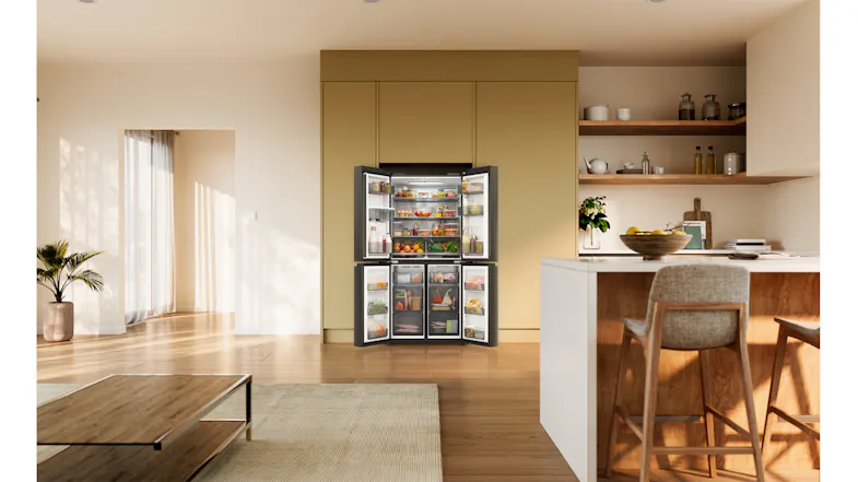 Front view of a silver Haier four-door refrigerator with all doors open, displaying stocked compartments Front view of a silver Haier four-door refrigerator with all doors open, displaying stocked compartments