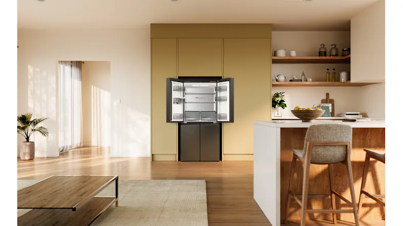 Front view of a silver Haier refrigerator with the upper doors open, showing empty interior shelves and drawers Front view of a silver Haier refrigerator with the upper doors open, showing empty interior shelves and drawers