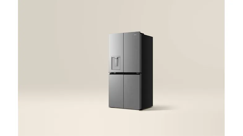 Front-angled view of a silver Haier four-door refrigerator with a water dispenser Front-angled view of a silver Haier four-door refrigerator with a water dispenser