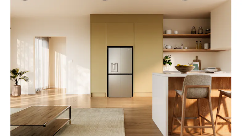 Front view of a silver Haier refrigerator with a water dispenser in a modern kitchen setting Front view of a silver Haier refrigerator with a water dispenser in a modern kitchen setting
