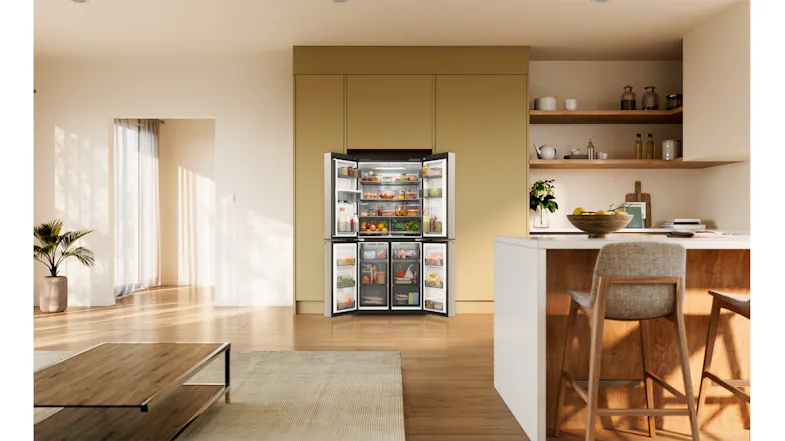 Front view of a silver Haier four-door refrigerator with all doors open, displaying stocked compartments Front view of a silver Haier four-door refrigerator with all doors open, displaying stocked compartments