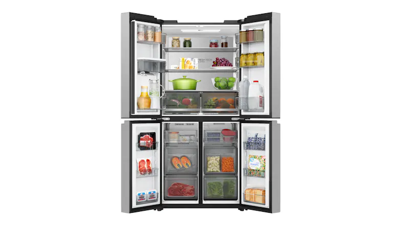 Front view of a silver four-door refrigerator fully stocked with groceries, open shelves, and freezer compartments Front view of a silver four-door refrigerator fully stocked with groceries, open shelves, and freezer compartments