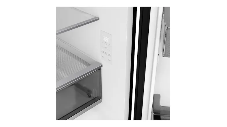 Close-up of a refrigerator interior with a digital touch control panel beside a glass shelf and crisper drawer Close-up of a refrigerator interior with a digital touch control panel beside a glass shelf and crisper drawer