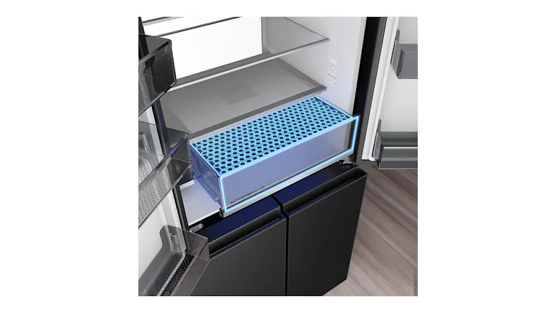 Angled close-up of a refrigerator freshness drawer with an illuminated cooling zone and a glass shelf above Angled close-up of a refrigerator freshness drawer with an illuminated cooling zone and a glass shelf above