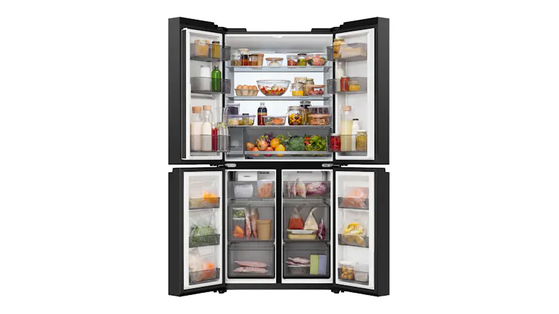 Front view of a black four-door Haier refrigerator with doors open, fully stocked with groceries and frozen foods Front view of a black four-door Haier refrigerator with doors open, fully stocked with groceries and frozen foods