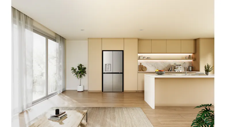 Wide-angle view of a silver Haier four-door refrigerator recessed into modern beige kitchen cabinetry Wide-angle view of a silver Haier four-door refrigerator recessed into modern beige kitchen cabinetry