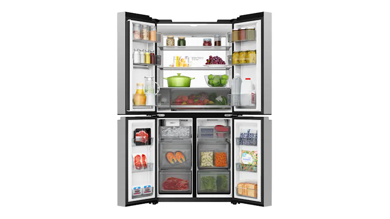 Silver Haier four-door refrigerator with open doors, stocked with groceries, produce, and frozen foods Silver Haier four-door refrigerator with open doors, stocked with groceries, produce, and frozen foods
