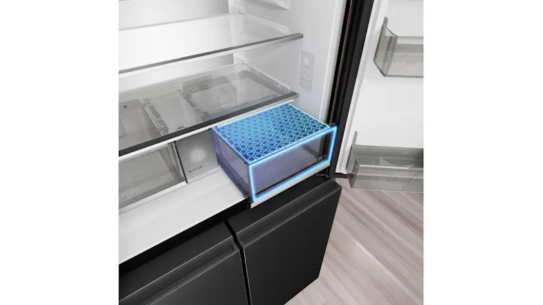 Angled view of a refrigerator freshness drawer with blue illumination, a water filter compartment, and glass shelves Angled view of a refrigerator freshness drawer with blue illumination, a water filter compartment, and glass shelves