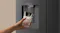 Close-up of a black refrigerator water dispenser dispensing chilled water into an ice-filled glass Close-up of a black refrigerator water dispenser dispensing chilled water into an ice-filled glass
