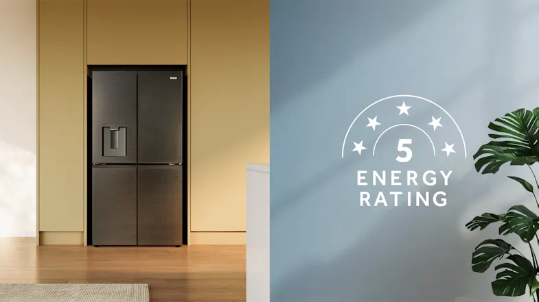 Front view of a black four-door refrigerator installed in a kitchen with a 5-star energy rating graphic Front view of a black four-door refrigerator installed in a kitchen with a 5-star energy rating graphic
