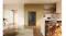 Front view of a black Haier 500 Series refrigerator recessed into modern kitchen cabinetry with timber shelving and island seating Front view of a black Haier 500 Series refrigerator recessed into modern kitchen cabinetry with timber shelving and island seating