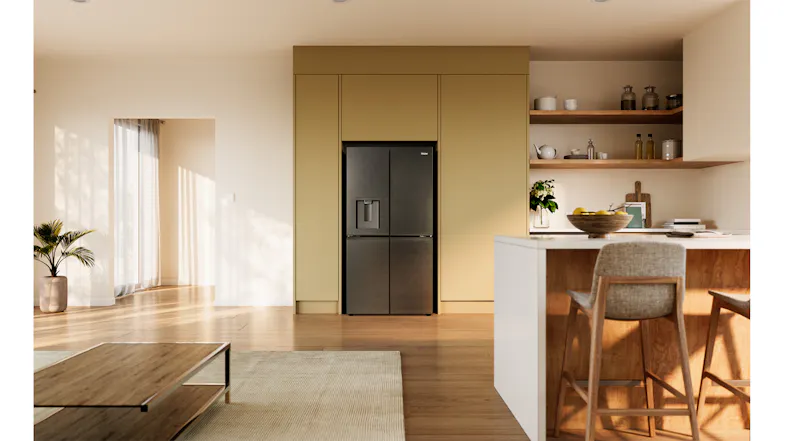 Front view of a black Haier 500 Series refrigerator recessed into modern kitchen cabinetry with timber shelving and island seating Front view of a black Haier 500 Series refrigerator recessed into modern kitchen cabinetry with timber shelving and island seating