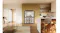 Black four-door refrigerator with all doors open, showcasing organised fridge and freezer compartments in a modern kitchen Black four-door refrigerator with all doors open, showcasing organised fridge and freezer compartments in a modern kitchen