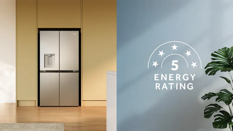 Silver quad-door refrigerator built into cabinetry with a water dispenser and a 5-star energy rating graphic Silver quad-door refrigerator built into cabinetry with a water dispenser and a 5-star energy rating graphic