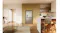 Silver quad-door refrigerator with a water dispenser integrated into modern built-in kitchen cabinetry Silver quad-door refrigerator with a water dispenser integrated into modern built-in kitchen cabinetry