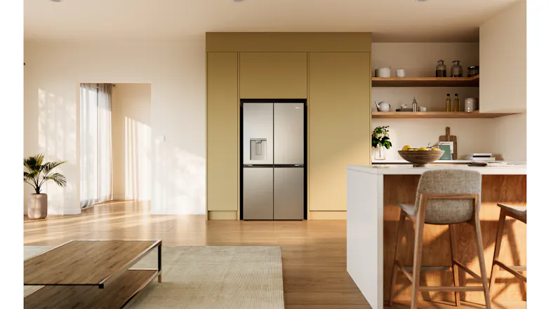 Silver quad-door refrigerator with a water dispenser integrated into modern built-in kitchen cabinetry Silver quad-door refrigerator with a water dispenser integrated into modern built-in kitchen cabinetry