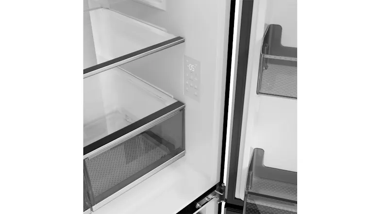 Close-up of a Haier refrigerator interior with a digital temperature control panel and glass shelving Close-up of a Haier refrigerator interior with a digital temperature control panel and glass shelving
