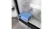 Angled interior view of a Haier refrigerator with an illuminated crisper drawer and glass shelf design Angled interior view of a Haier refrigerator with an illuminated crisper drawer and glass shelf design
