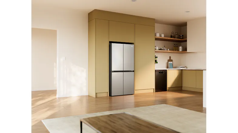 Silver Haier four-door refrigerator installed in a modern kitchen with a built-in cabinet surround Silver Haier four-door refrigerator installed in a modern kitchen with a built-in cabinet surround
