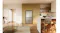 Silver Haier quad-door refrigerator built into kitchen cabinetry with a brushed metal finish Silver Haier quad-door refrigerator built into kitchen cabinetry with a brushed metal finish