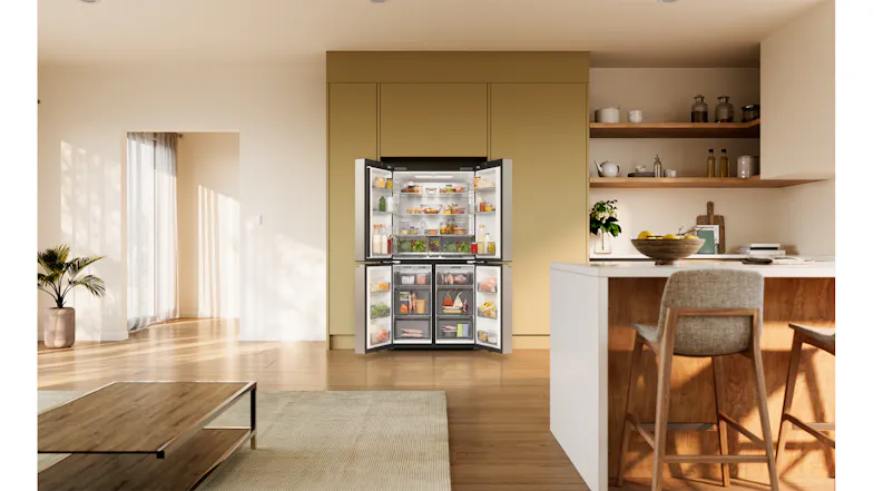 Open silver Haier four-door refrigerator in a modern kitchen, stocked with food and beverages Open silver Haier four-door refrigerator in a modern kitchen, stocked with food and beverages