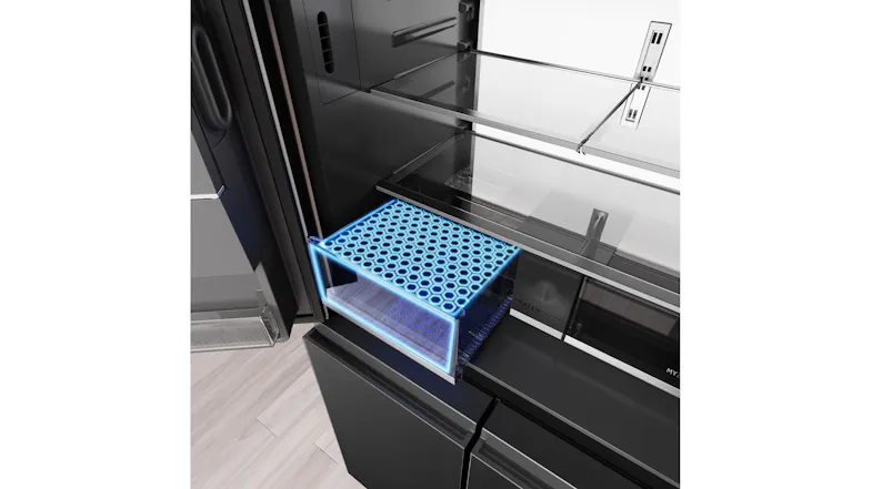 Angled interior view of a refrigerator drawer with blue freshness zone illumination and glass shelving above Angled interior view of a refrigerator drawer with blue freshness zone illumination and glass shelving above