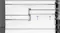 Close-up view of an adjustable refrigerator glass shelf system with raised shelf configuration indicators Close-up view of an adjustable refrigerator glass shelf system with raised shelf configuration indicators