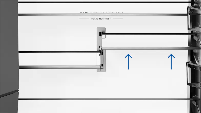 Close-up view of an adjustable refrigerator glass shelf system with raised shelf configuration indicators Close-up view of an adjustable refrigerator glass shelf system with raised shelf configuration indicators