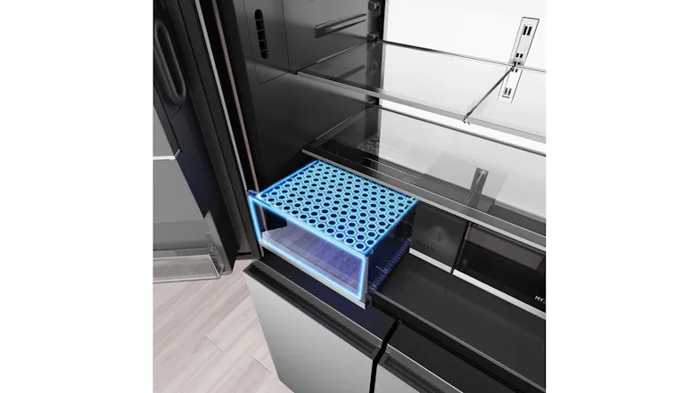 Angled interior view of a refrigerator crisper drawer with an illuminated freshness-zone storage compartment Angled interior view of a refrigerator crisper drawer with an illuminated freshness-zone storage compartment