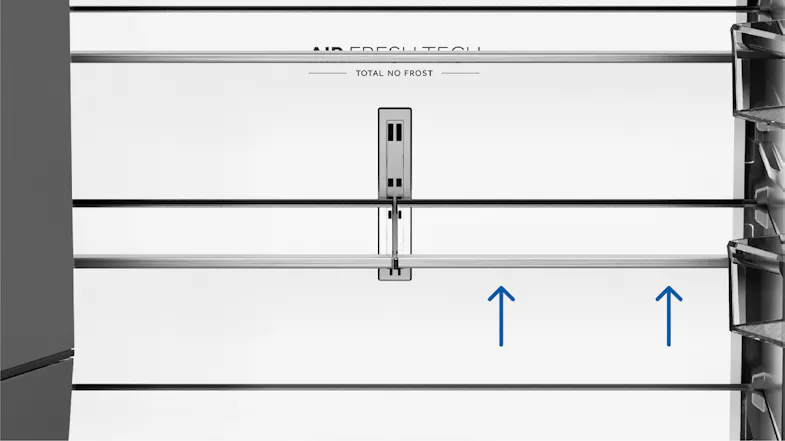 Close-up of the refrigerator interior with an adjustable glass shelf system and central sliding shelf mechanism Close-up of the refrigerator interior with an adjustable glass shelf system and central sliding shelf mechanism