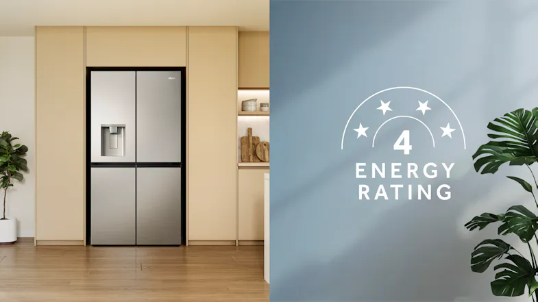 Silver four-door refrigerator in a modern kitchen with a built-in water dispenser and a 4-star energy rating Silver four-door refrigerator in a modern kitchen with a built-in water dispenser and a 4-star energy rating