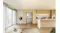 Front view of a Haier 600 Series refrigerator with a built-in water dispenser in a modern kitchen setting Front view of a Haier 600 Series refrigerator with a built-in water dispenser in a modern kitchen setting