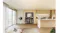 Front view of a quad-door refrigerator with all doors fully open, stocked shelves, and visible freezer compartments Front view of a quad-door refrigerator with all doors fully open, stocked shelves, and visible freezer compartments