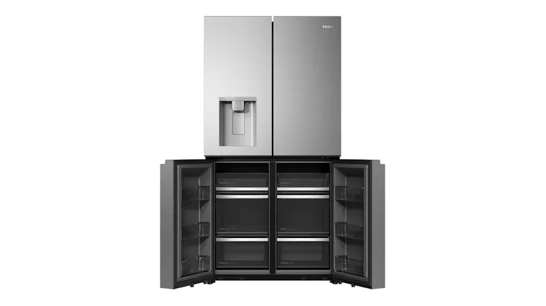 Front view of a silver four-door refrigerator with the lower freezer doors open and drawer compartments visible Front view of a silver four-door refrigerator with the lower freezer doors open and drawer compartments visible