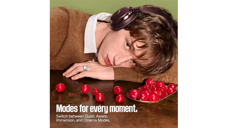 Person resting while wearing headphones, styled with red cherries Person resting while wearing headphones, styled with red cherries