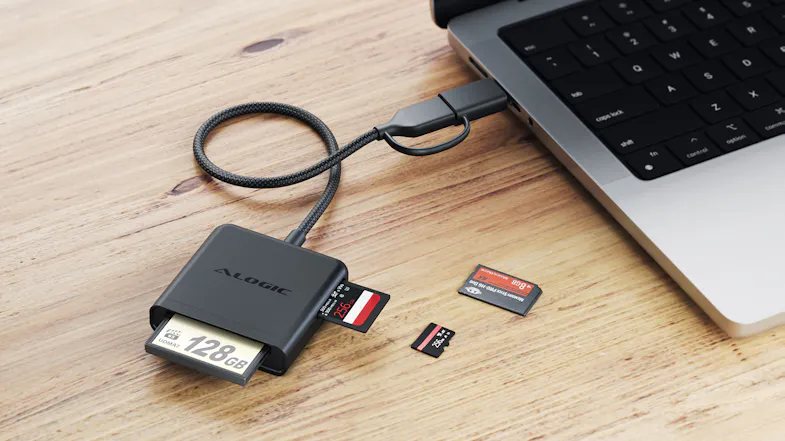 Alogic multi-card reader connected to a laptop via a braided cable, with CF, SD, and microSD cards partially inserted Alogic multi-card reader connected to a laptop via a braided cable, with CF, SD, and microSD cards partially inserted