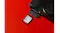Angled view of a SanDisk Ultra GO SDHC UHS-I memory card beside an open camera card slot Angled view of a SanDisk Ultra GO SDHC UHS-I memory card beside an open camera card slot