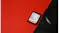 Close-up angled view of a SanDisk Ultra GO SDHC UHS-I memory card next to a black camera Close-up angled view of a SanDisk Ultra GO SDHC UHS-I memory card next to a black camera