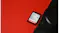 Close-up angled view of a SanDisk Ultra GO SDHC UHS-I memory card next to a black camera Close-up angled view of a SanDisk Ultra GO SDHC UHS-I memory card next to a black camera