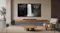 Front view of a TCL home theatre setup with a wall-mounted TV, soundbar, wireless speakers, and subwoofer Front view of a TCL home theatre setup with a wall-mounted TV, soundbar, wireless speakers, and subwoofer