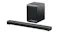 Angled view of a black TCL soundbar with a metal mesh grille and matching wireless subwoofer with curved edges Angled view of a black TCL soundbar with a metal mesh grille and matching wireless subwoofer with curved edges