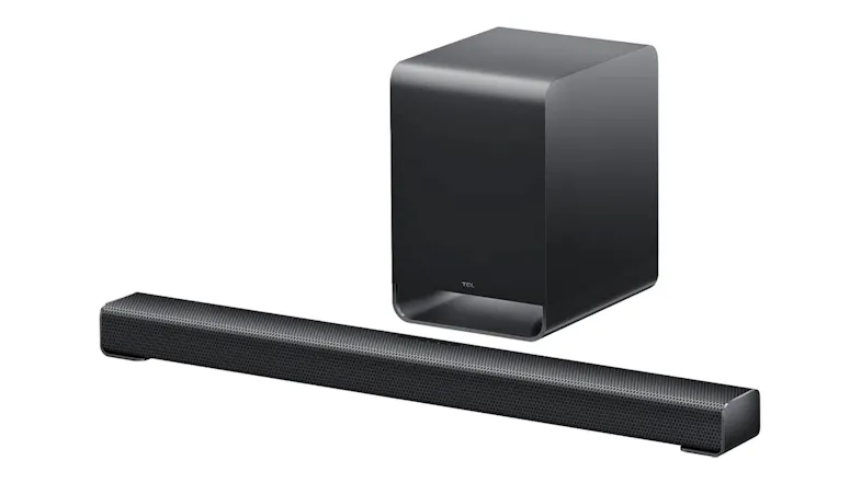Angled view of a black TCL soundbar with a metal mesh grille and matching wireless subwoofer with curved edges Angled view of a black TCL soundbar with a metal mesh grille and matching wireless subwoofer with curved edges